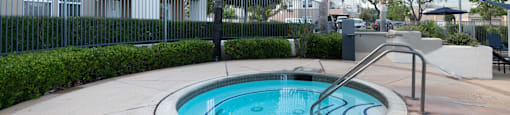 A small round pool with a metal ladder.