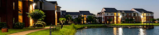 a lake in front of a building