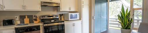 a kitchen and dining area in a 555 waverly unit