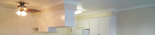 View of kitchen with white cabinets
