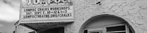 a black and white photo of the front of a building