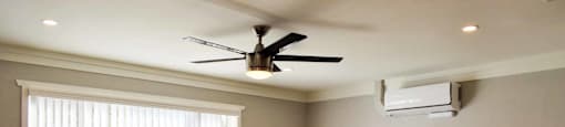 living room with wood look flooring, large floor to ceiling window, and ceiling fan