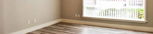 living room with wood look flooring, large floor to ceiling window, and ceiling fan