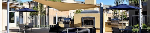 Community grilling station with covered seating areas