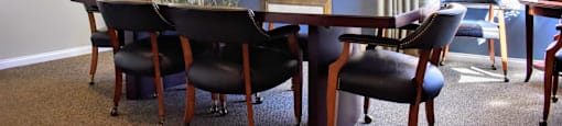 Club room with meeting area, large table with several chairs
