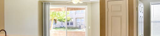 View from entry of unit looking out patio and bedroom