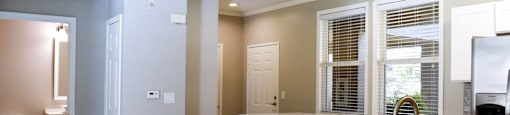 View from living room towards the front door an hall with bathroom