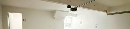 A large empty room with a white ceiling and walls.