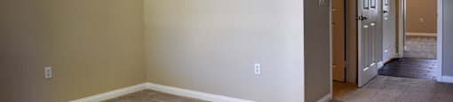 view of bedroom and hallway leading to second bedroom