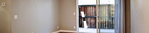 living room wot wood styled ceramic flooring and patio view with sliding glass doors