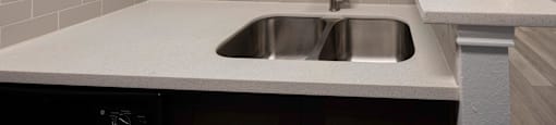 a kitchen with a sink and a window