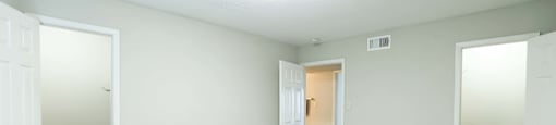 A large bedroom with walk in closets