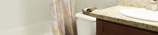 Bathroom with bathtub and large mirror
