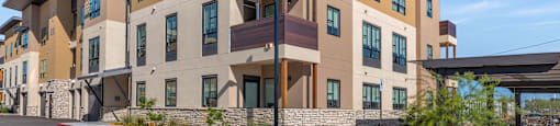Building with balconies and a sidewalk at Solace at Ballpark Village, Goodyear, Arizona
