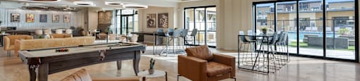 A modern living room with a glass ceiling and a dining area at Solace at Ballpark Village, Goodyear, AZ, Arizona  , 85338