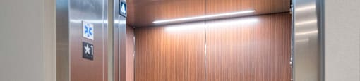 Silver elevator doors at Solace at Ballpark Village, Goodyear