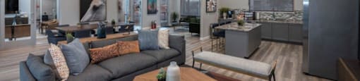 a living room with couches and a table and a chandelier at Inspiration Apartments, Cottonwood