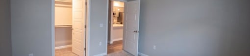 a bedroom with a closet and a door to a bathroom at Inspiration Apartments, Cottonwood, AZ, 86326