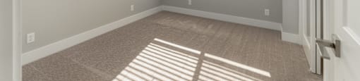 A room with a window and a door.