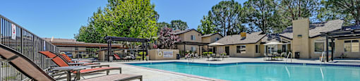 the reserve at city center apartments swimming pool with tables and chairs