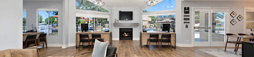 a living room with couches and chairs and a fireplace