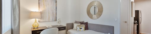 a bedroom with a bed and a desk with a chair