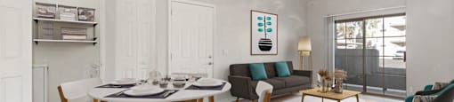 a living room with a dining room table and a couch