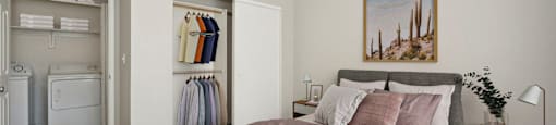 a bedroom with a bed and a closet with a laundry room