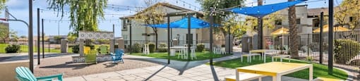 a large patio with picnic tables and chairs at Biscayne Bay
