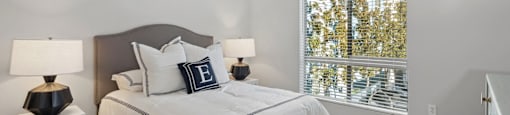 Spacious bedroom with a large window