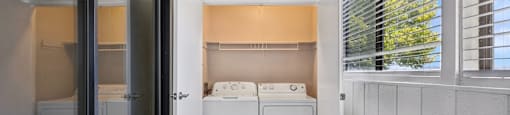 a laundry room with a washer and dryer in it