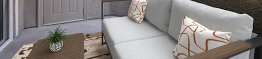 a patio with a couch and a table and a door
