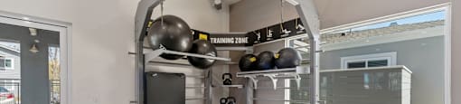 gym with free weights at Pointe Luxe Apartment Homes, San Diego, CA, 92110