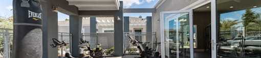 gym with outdoor workout area at Pointe Luxe Apartment Homes, San Diego, CA