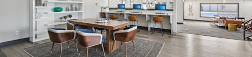 A modern dining room with a wooden table and chairs.