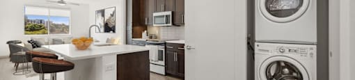 a kitchen with a washing machine and a washer and dryer