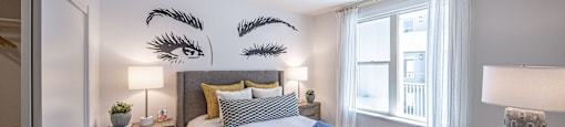 a bedroom with a large bed and a window