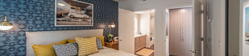 a bedroom with a large bed and a ceiling fan