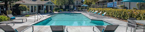 Swimming Pool With Lounge Chairs at Atwood Apartments, Citrus Heights, CA