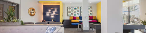 a living room with couches and chairs