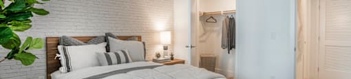 a bedroom with a bed and a closet