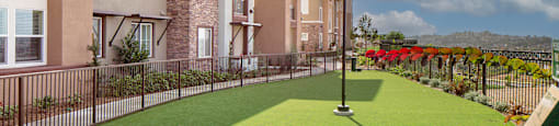 A building with a green lawn in front of it.