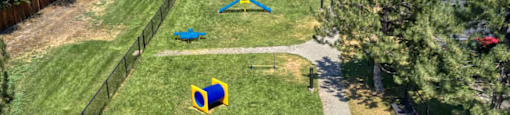 an aerial view of a park with playground equipment