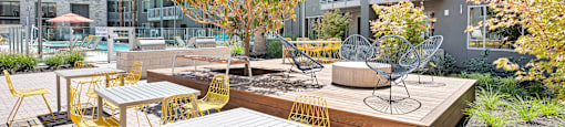 an outdoor patio with tables and chairs