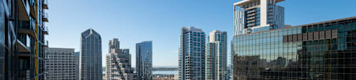 a view of the city from a skyscraper with tall buildings