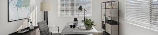 an office with a desk and a chair and a window