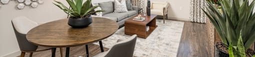 a living room with a round table and a couch