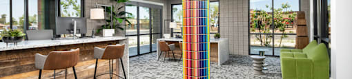 a lobby with a colorful column in the middle of a room