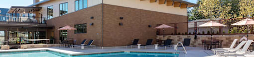 Pool Side Relaxing Area With Sundeck at Tivalli Apartments, Lynnwood, WA