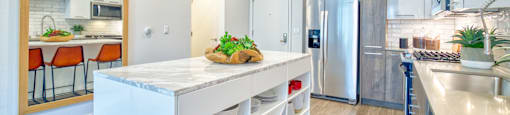 spacious kitchen with an island at Aya Apartments